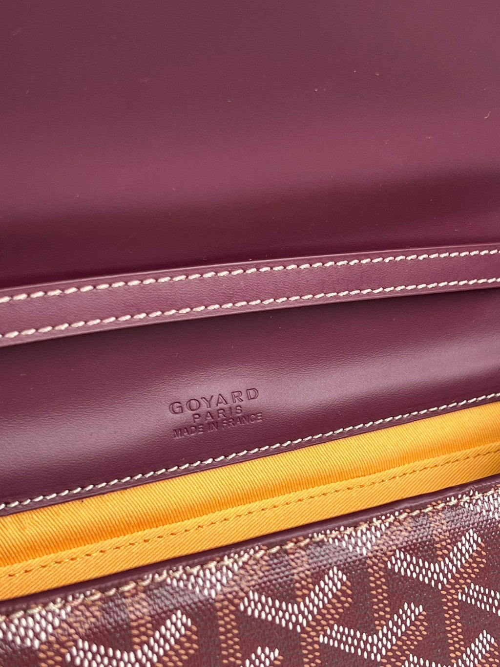 MONTE-CARLO PM CLUTCH 25 IN WINE RED GOYARDINE CANVAS