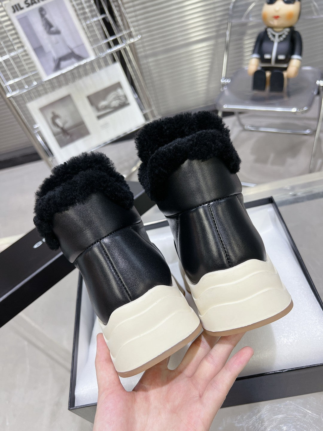 CHANEL MARTIN BOOTS IN BLACK CALFSKIN AND LAMB FUR LINING