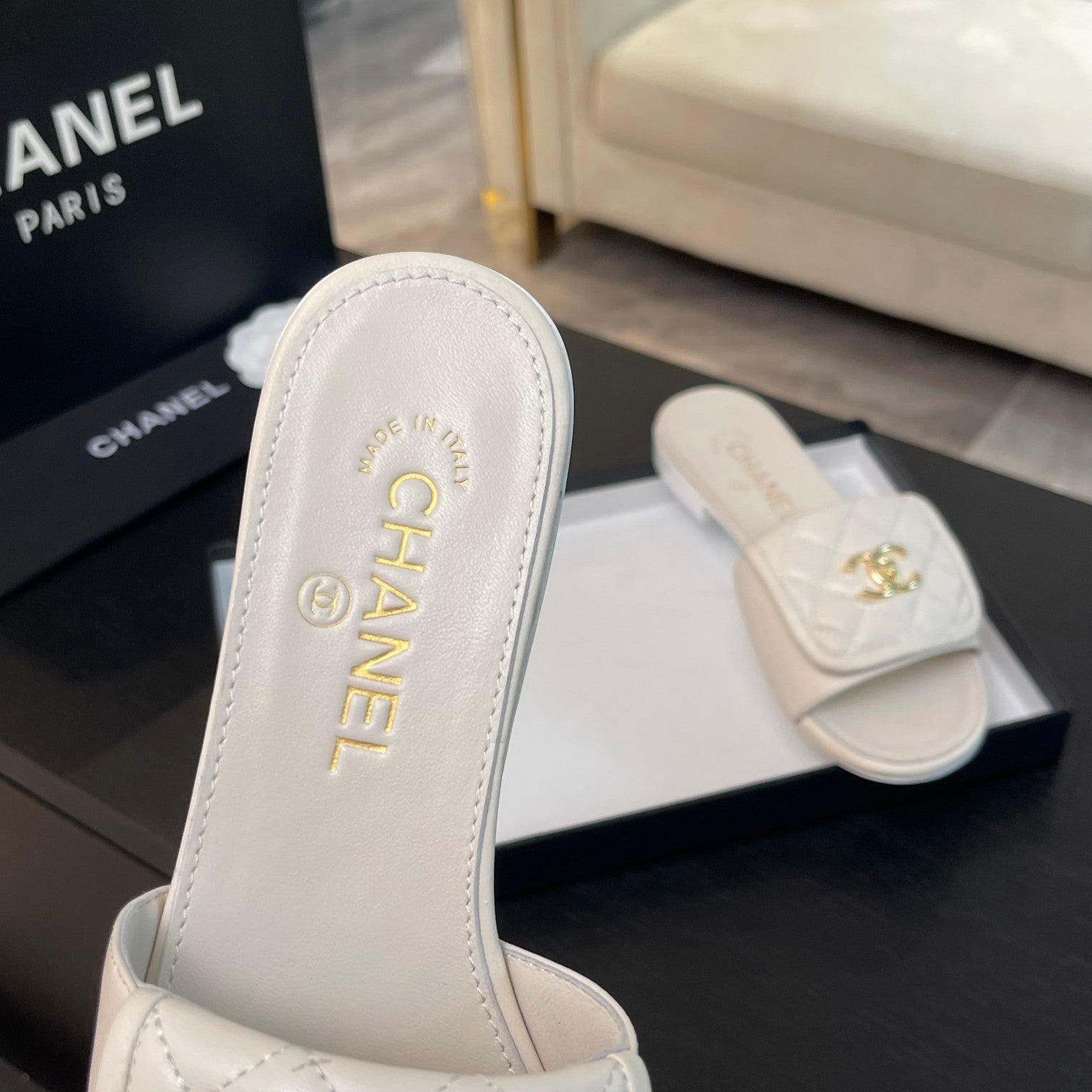 CHANEL FLAT MULE IN WHITE LAMBSKIN